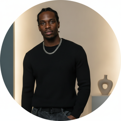 Portrait of Alex Bennett, a masculine influencer, looking confident and approachable against a clean background with warm cre